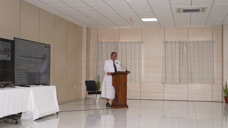 Rev. Prof. Vaitusi Nofoaiga leading the induction in devotion.